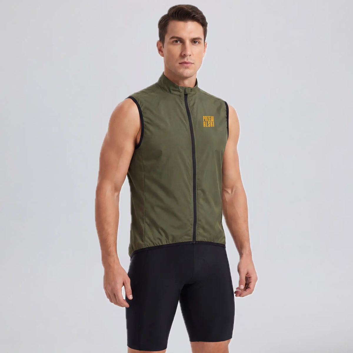 Front three-quarter view of a model wearing an army green men's windproof cycling vest.