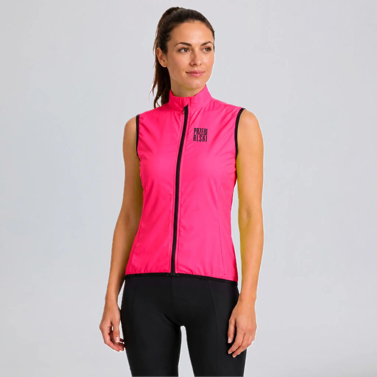 Front view of a model wearing a rose red women's windproof cycling vest.