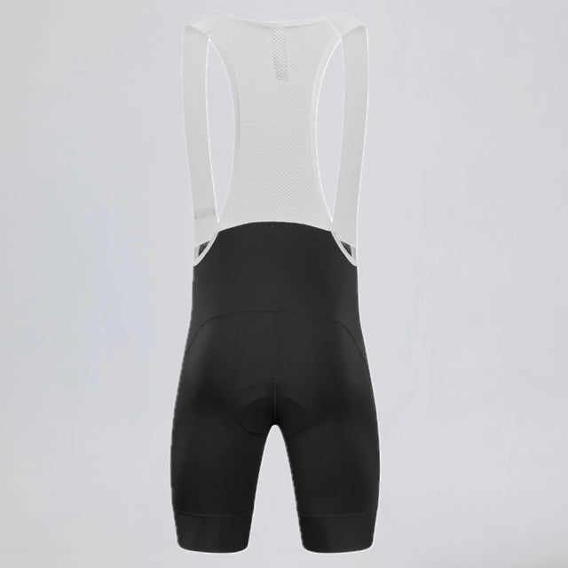Back view of black men's MTB endurance bib shorts with white mesh straps.