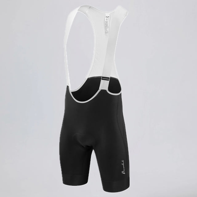 Front three-quarter view of black men's MTB endurance bib shorts with white mesh straps.