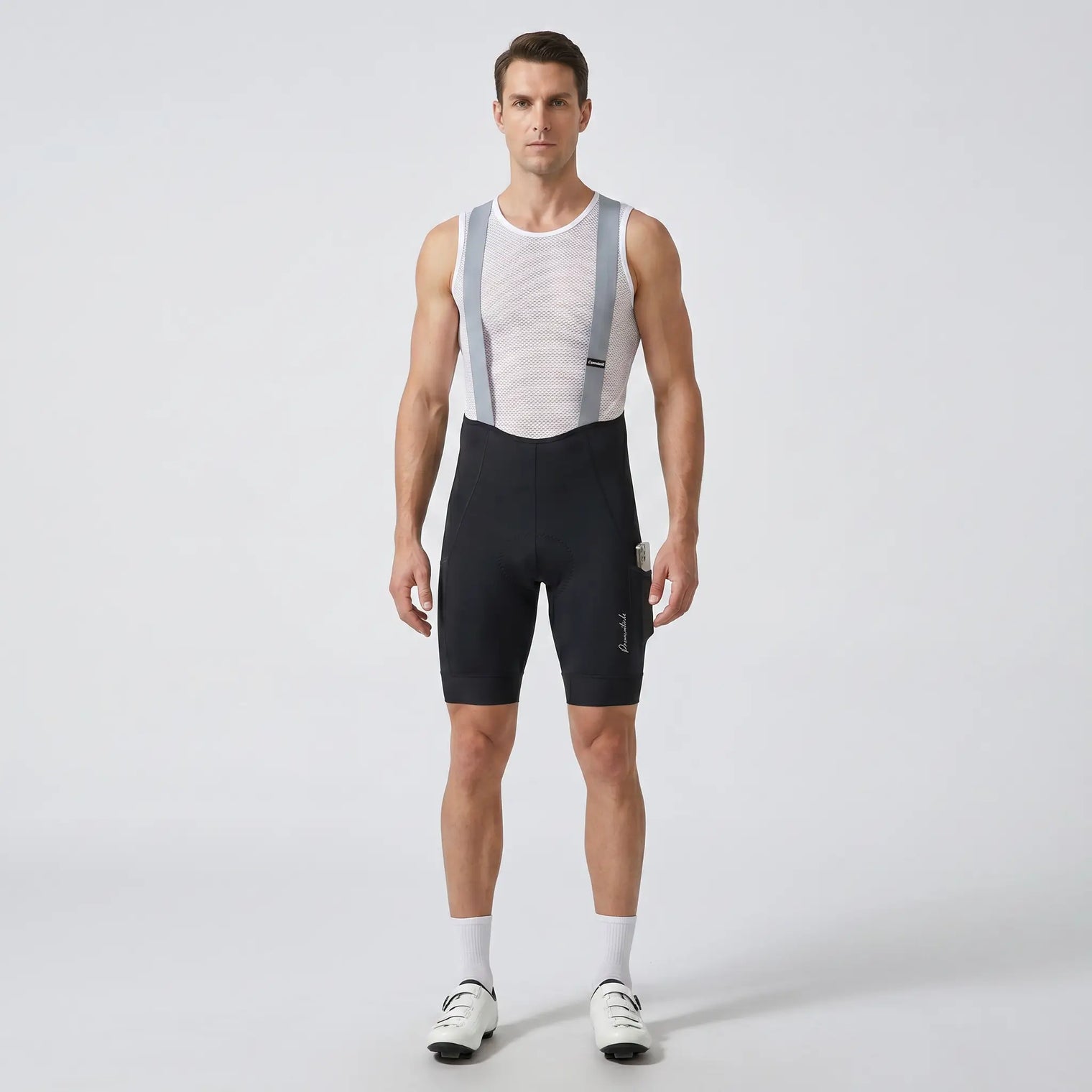 Men’s long distance cycling bib shorts front view showing ergonomic fit, straps, and compression design