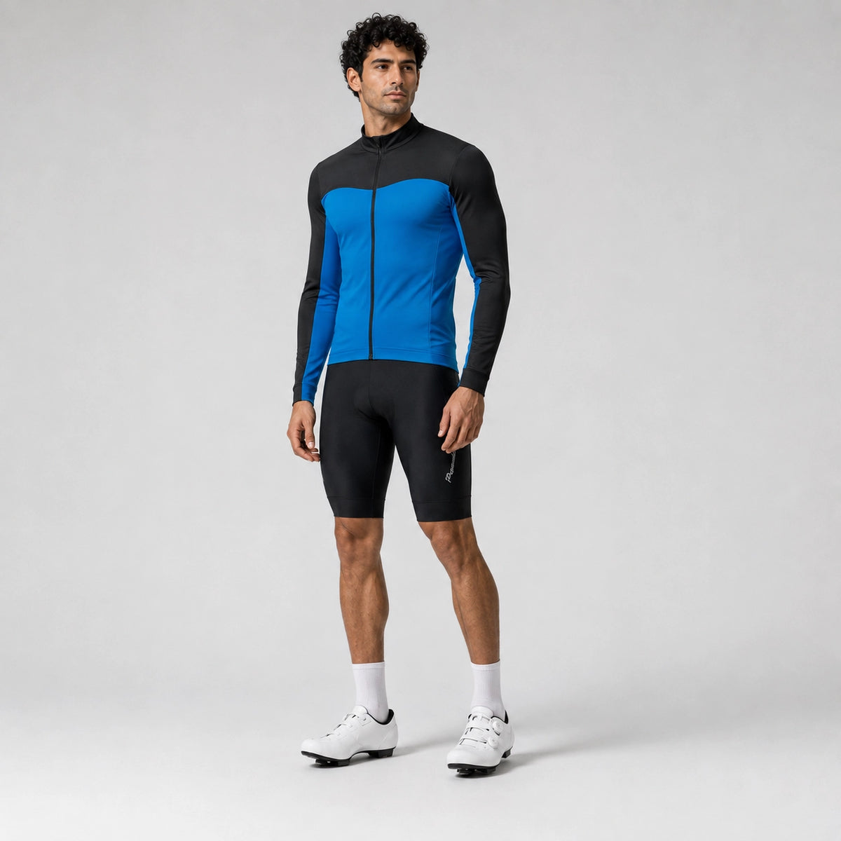 Full-length front view of a model wearing a blue men's winter fleece cycling jacket.