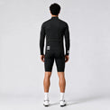 Back view of a model wearing a black men's thermal cycling jacket.