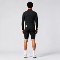 Back view of a model wearing a black men's thermal cycling jacket.