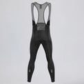 Back view of black men's winter fleece cycling bib tights with mesh straps.