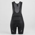 Back view of black women's road cycling bib shorts with reflective details.