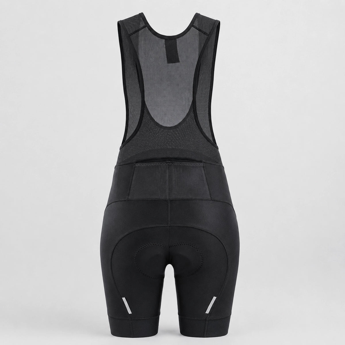 Back view of black women's road cycling bib shorts with reflective details.