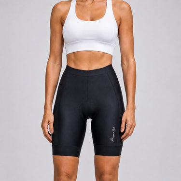 Front close-up of a model wearing black women's road cycling shorts.