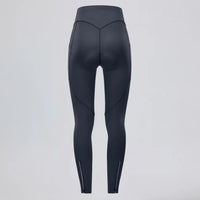 Back view of women's black thermal fleece cycling tights with side pockets and ankle zippers.