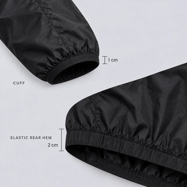 Close-up of 1 cm cuff and 2 cm elastic rear hem on black windproof cycling jacket