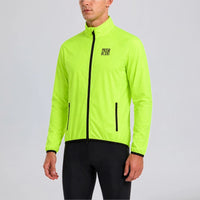 Front view of a model wearing the green men's lightweight windproof cycling jacket.
