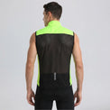 Back view of a model wearing a bright green men's windproof cycling vest with a breathable mesh panel.