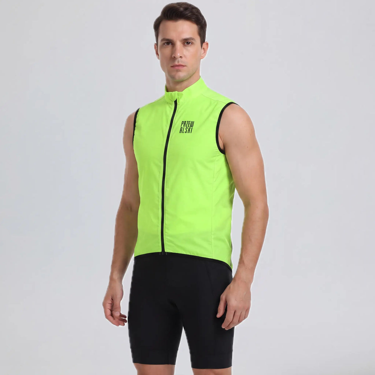 Front view of a model wearing a bright green men's windproof cycling vest.