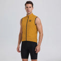 Front view of a model wearing an orange men's windproof cycling vest.