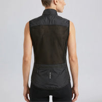 Back view of a model wearing a black women's windproof cycling vest with rear pocket.