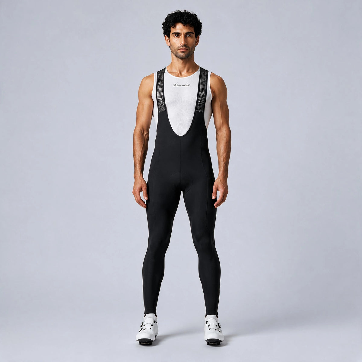 Front view of a model wearing black men's winter fleece road cycling bib tights.