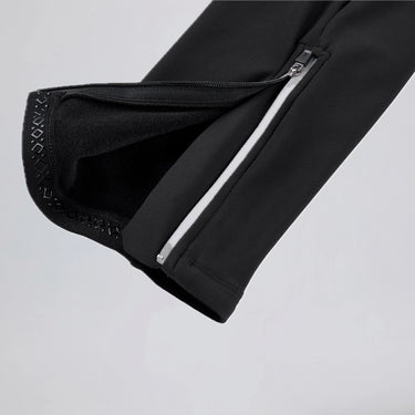Close-up of the ankle zipper and leg gripper on men's winter thermal road cycling bib tights.