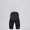 Back view of black men's MTB endurance bib shorts with white mesh straps.