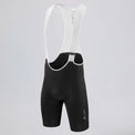 Front three-quarter view of black men's MTB endurance bib shorts with white mesh straps.