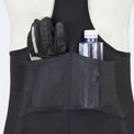 Men’s long distance cycling bib shorts showing rear mesh pocket storing gloves and water bottle