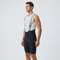 Men’s long distance cycling bib shorts side view showing leg pocket, straps, and ergonomic compression fit