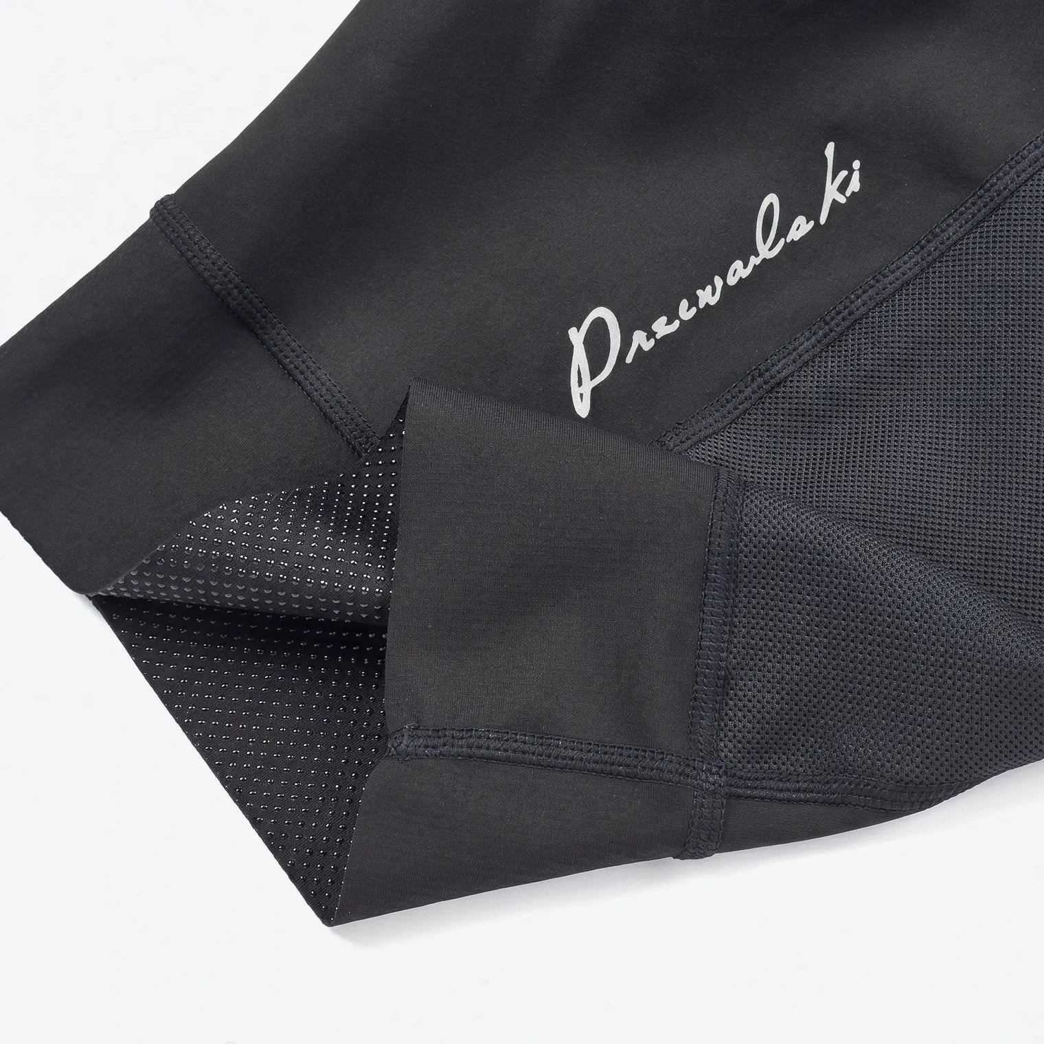 Men’s long distance cycling bib shorts showing inner silicone gripper, anti-slip design, and secure leg opening fit