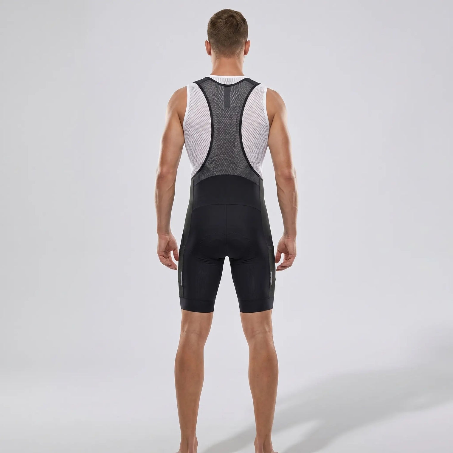 Men’s MTB Racing Bib Shorts PRO rear view showing mesh back panel, wide straps, and compression fit