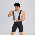 Model stretching a front shoulder strap on black men's cargo cycling bib shorts.